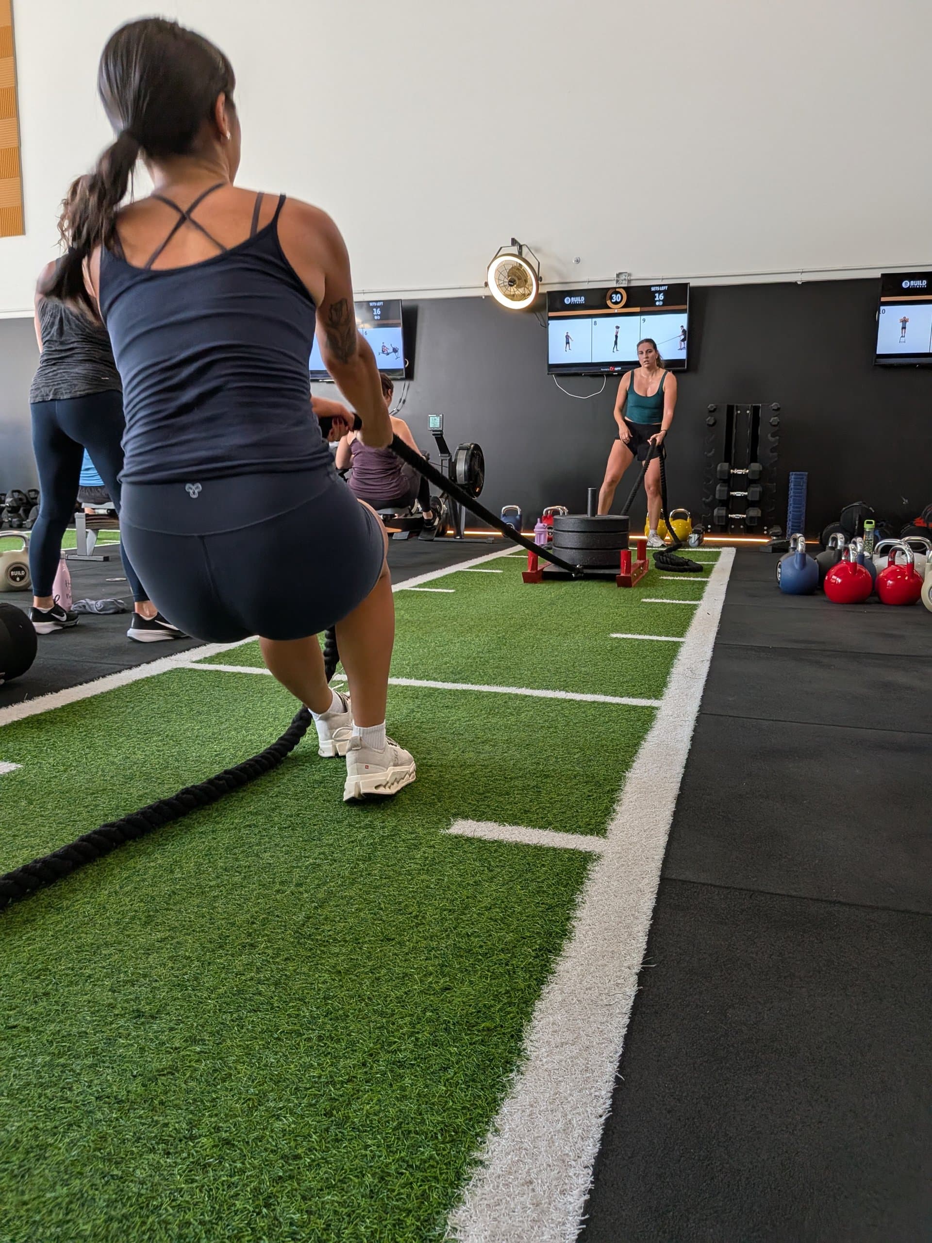 Group battle rope work on the turf at Build Fitness in Port Coquitlam